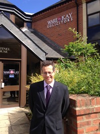 David Hyams In Front Of New Sign